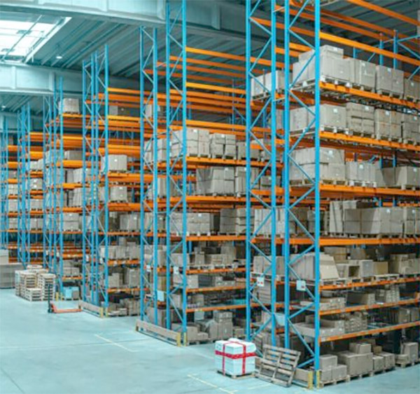 Vendor-Managed Inventory, boxes of maunfactured industrial parts on skids in metal shelving